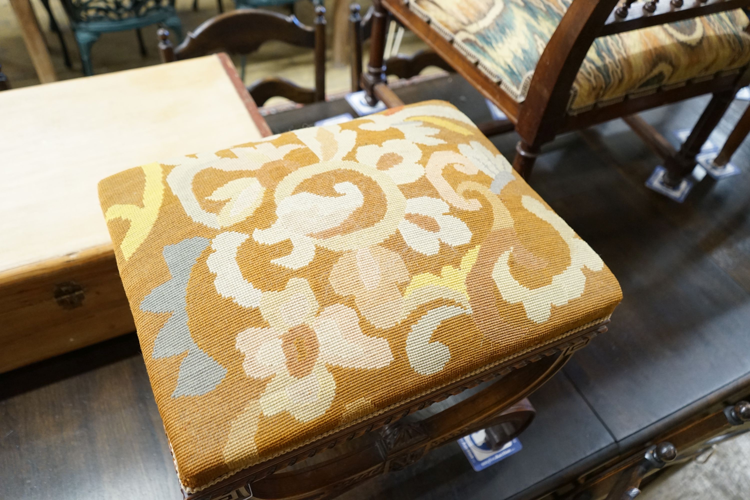 An early 20th century French walnut X frame stool, width 52cm, depth 42cm, height 45cm